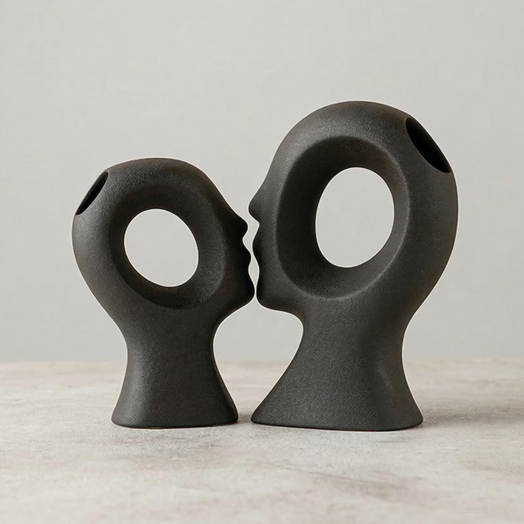 Obsidian black abstract couple ceramic vases, sculptural ring openings, standing pair