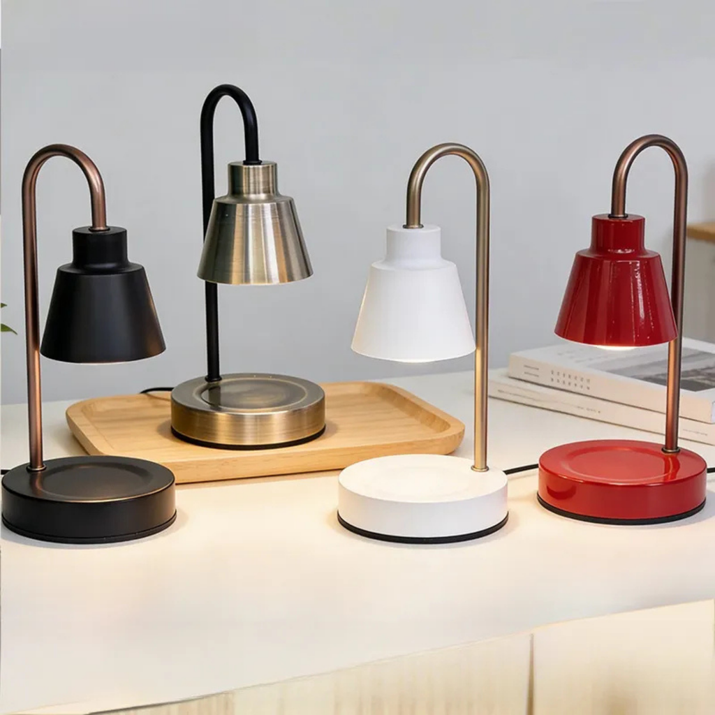 Set of adjustable candle warmer lamps in black, silver, white, and red with curved stands