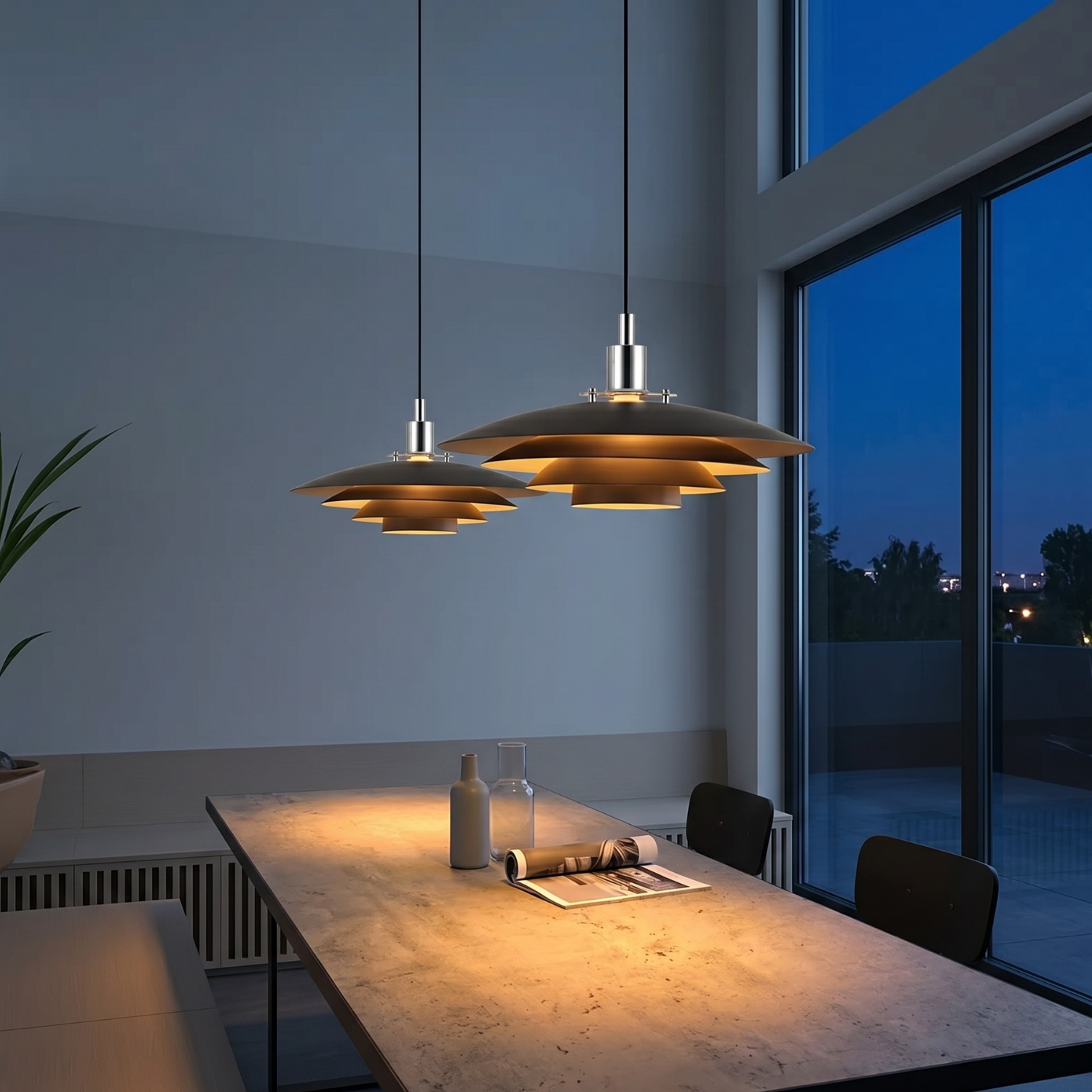 Black layered pendant chandelier with three-tier shades hanging above dining table