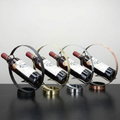 Metal floating-circle single wine bottle holder stand in black, gold, silver, bronze