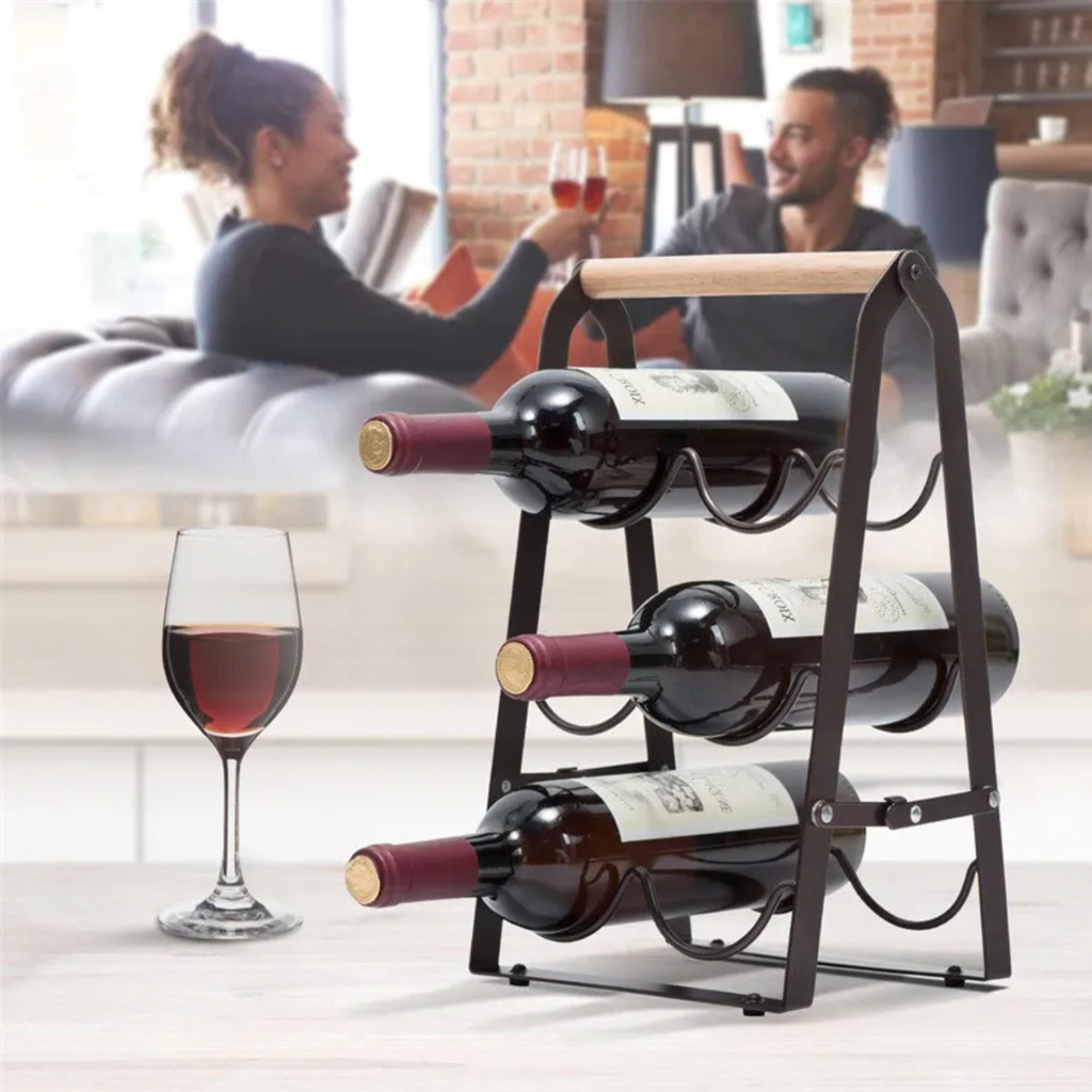 Black metal and wood desktop wine rack with 3 wine bottles resting in loops