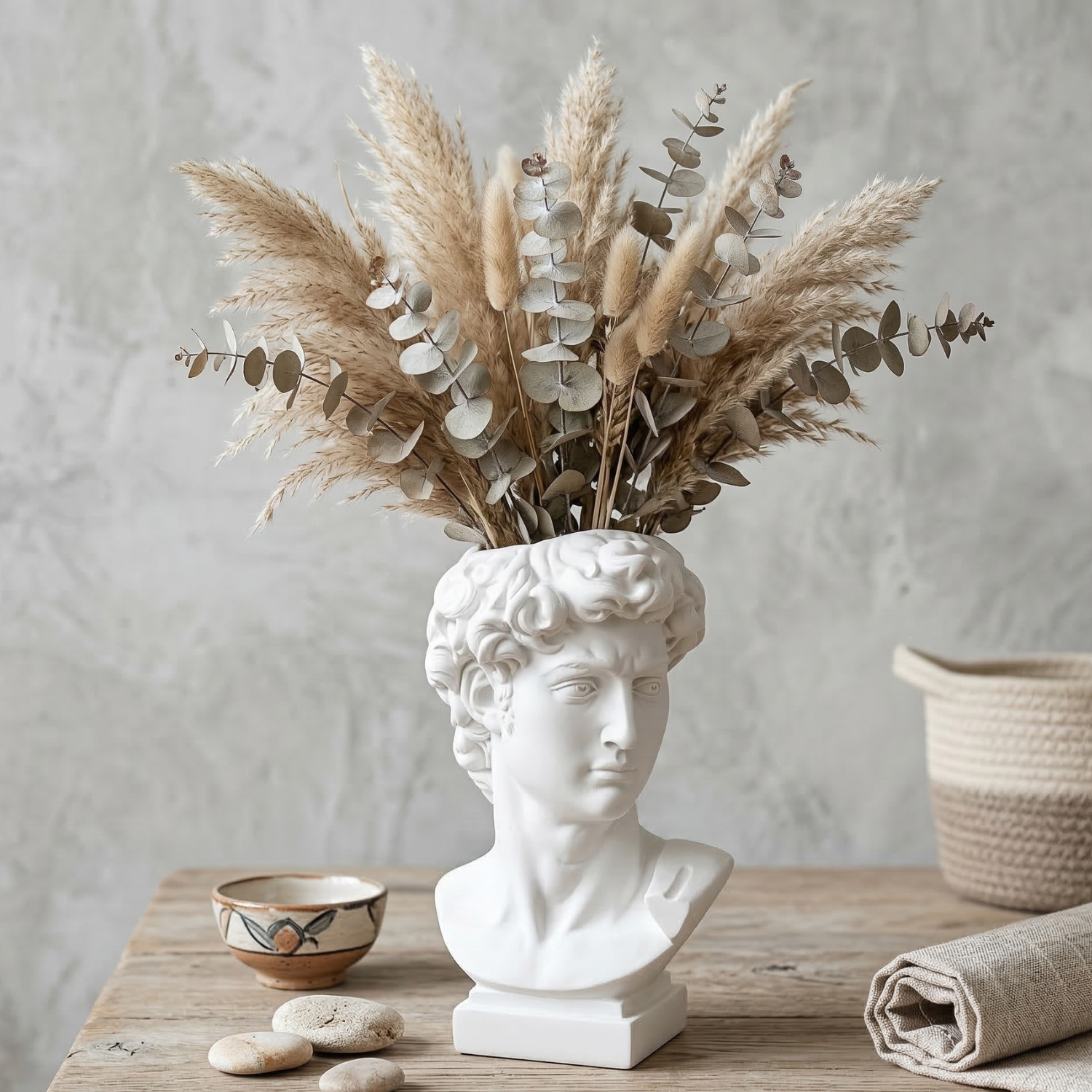 White Greek David bust vase with dried pampas stems and leaves arrangement