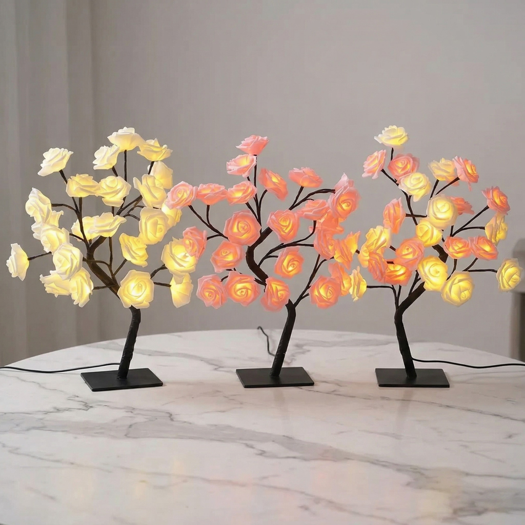 Three LED tree lights with floral design on a marble surface.