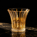 Leaf crystal whiskey tumbler with gold rim, flared cup and botanical cut leaf pattern