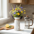 Marble ceramic vase with gold band accent and white marble print, holding flowers