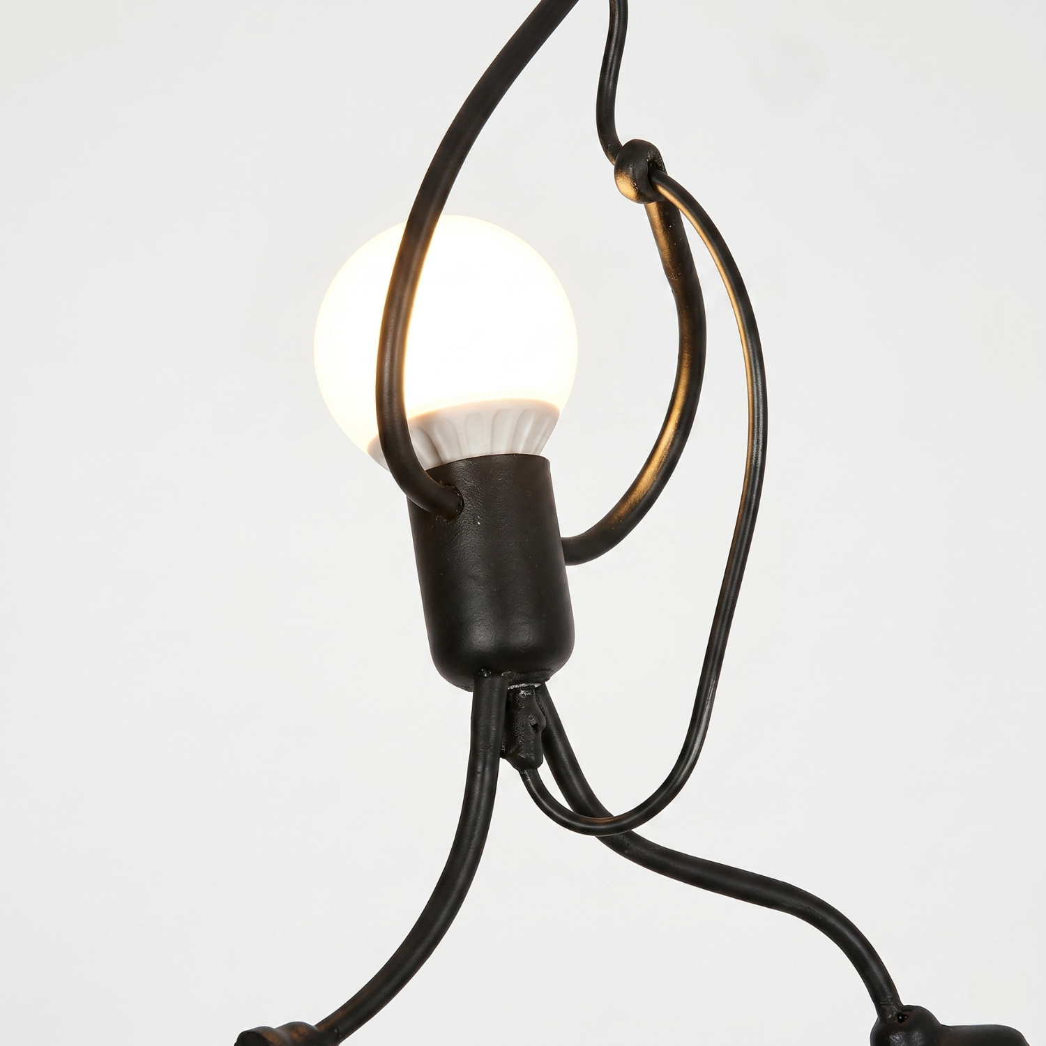 Close-up of a hanging light fixture with a bulb on a white background