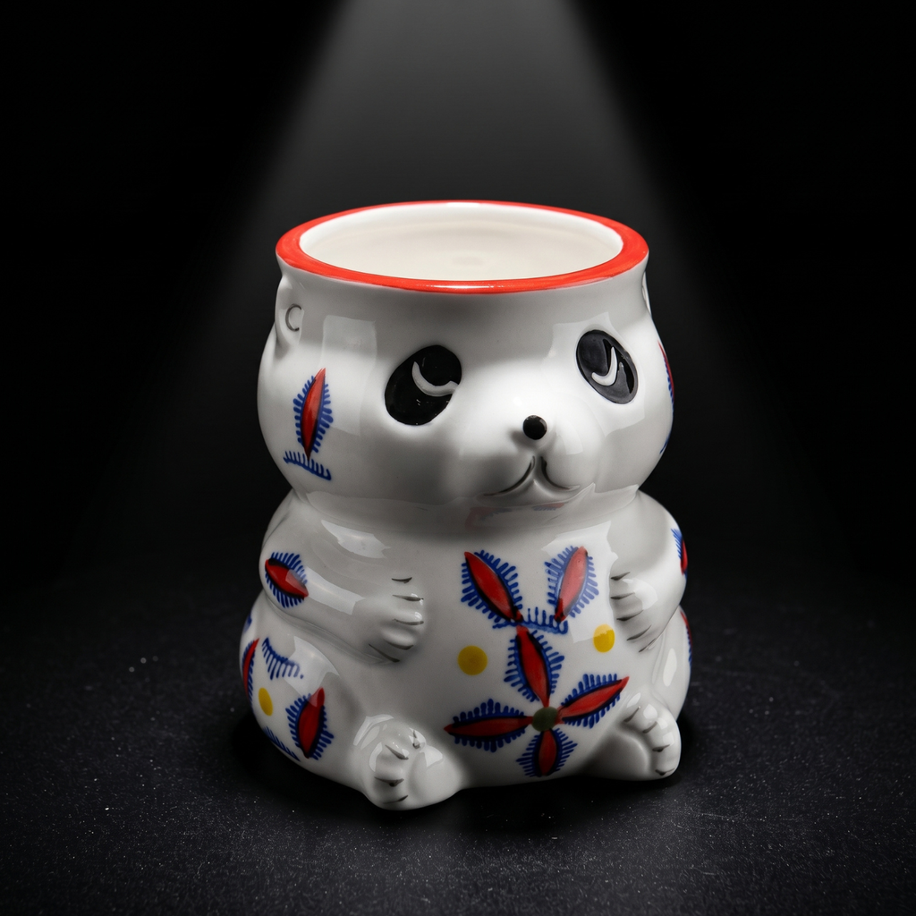 Panda tiki mug close-up, white ceramic with blue/red floral pattern and red rim