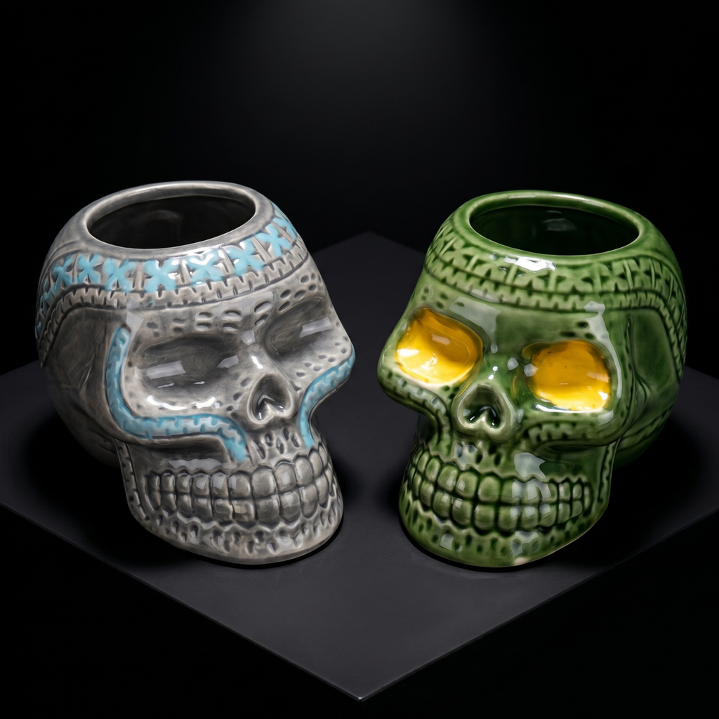 Gray and green pirate skull ceramic mugs with open mouths and yellow eyes