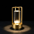 Gold rechargeable LED lantern table lamp with glass cylinder and metal frame