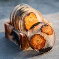 Round resin wood coaster—clear top with orange pine slices and dark resin marbling