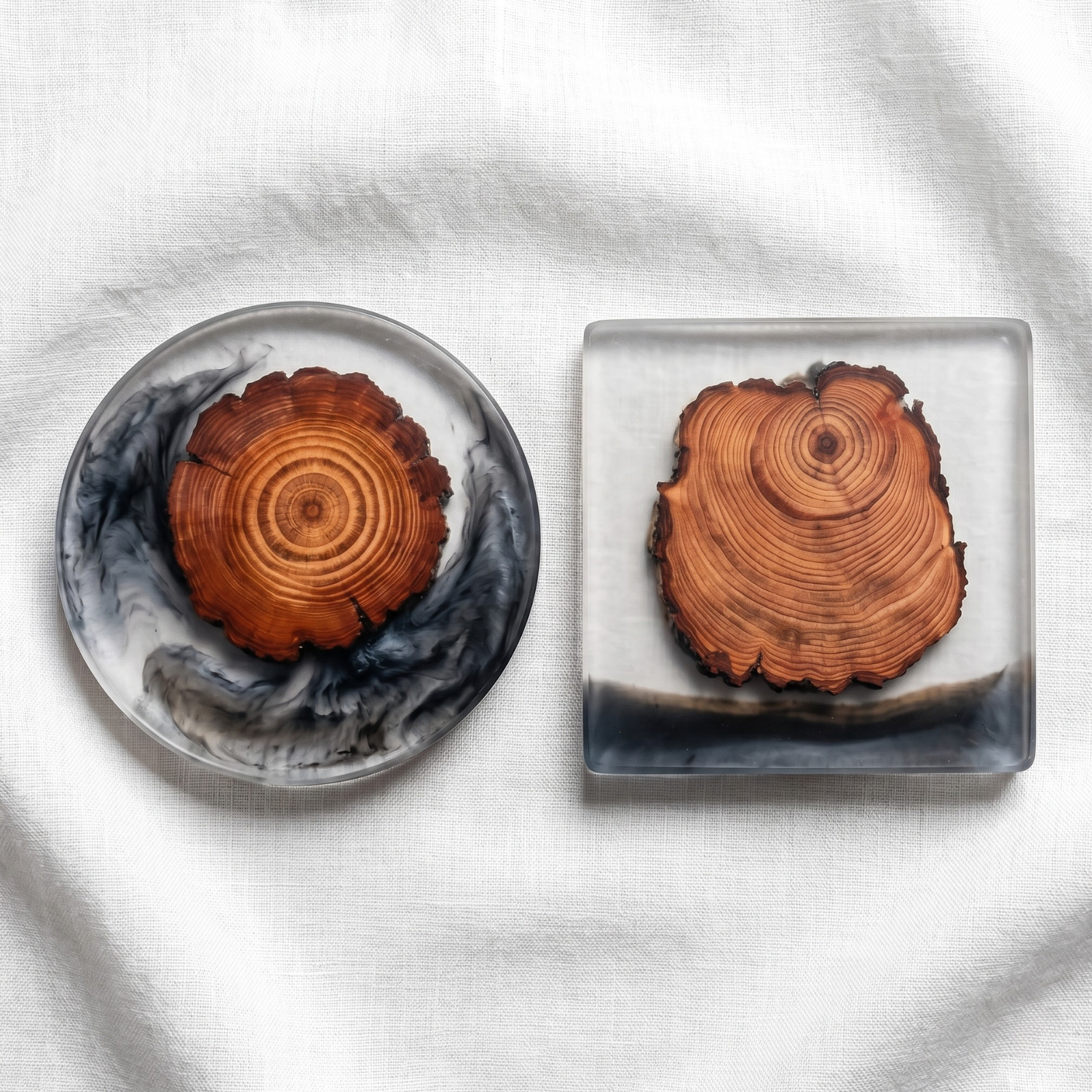 Resin wood coaster set—one round and one square, orange pine slices with black epoxy