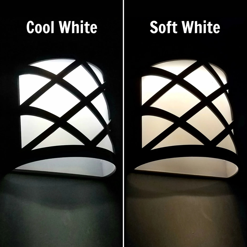 Two wall lights side by side, one labeled 'Cool White' and the other 'Soft White', on a black background.