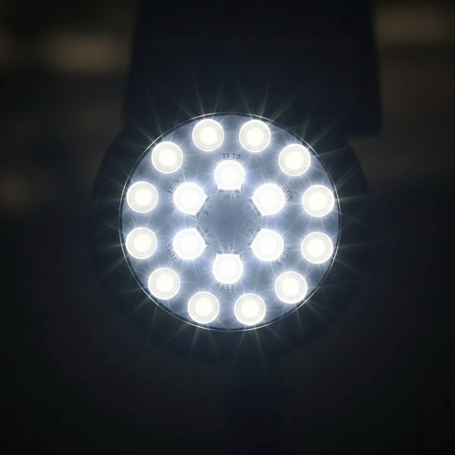 Round solar spotlight head with 18 LED bulbs glowing, close-up view
