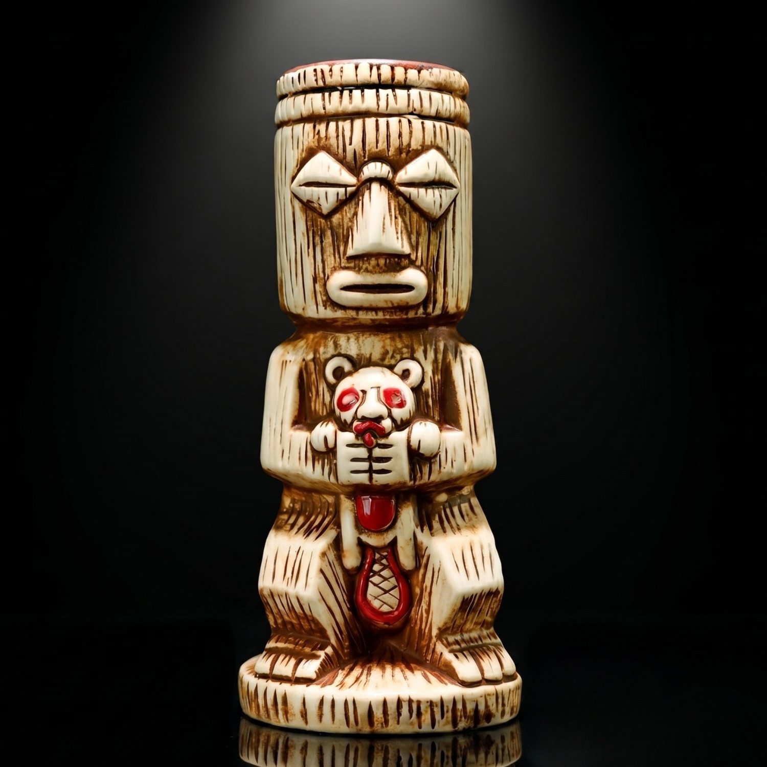 Close-up of tall tiki totem mug ceramic figure with tribal face and bear character