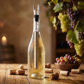 Stainless wine chiller stick inserted in bottle with aerator pourer cap, for cooling wine